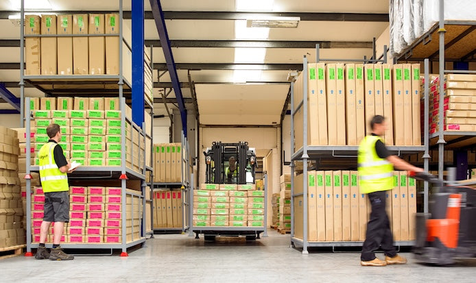 kaydian warehouse photograph showing lots of tv beds in stock and being moved around on a forklift